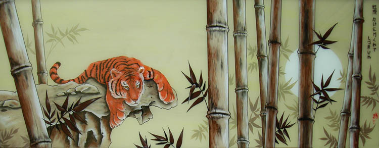 Молодой тигр в бамбуке